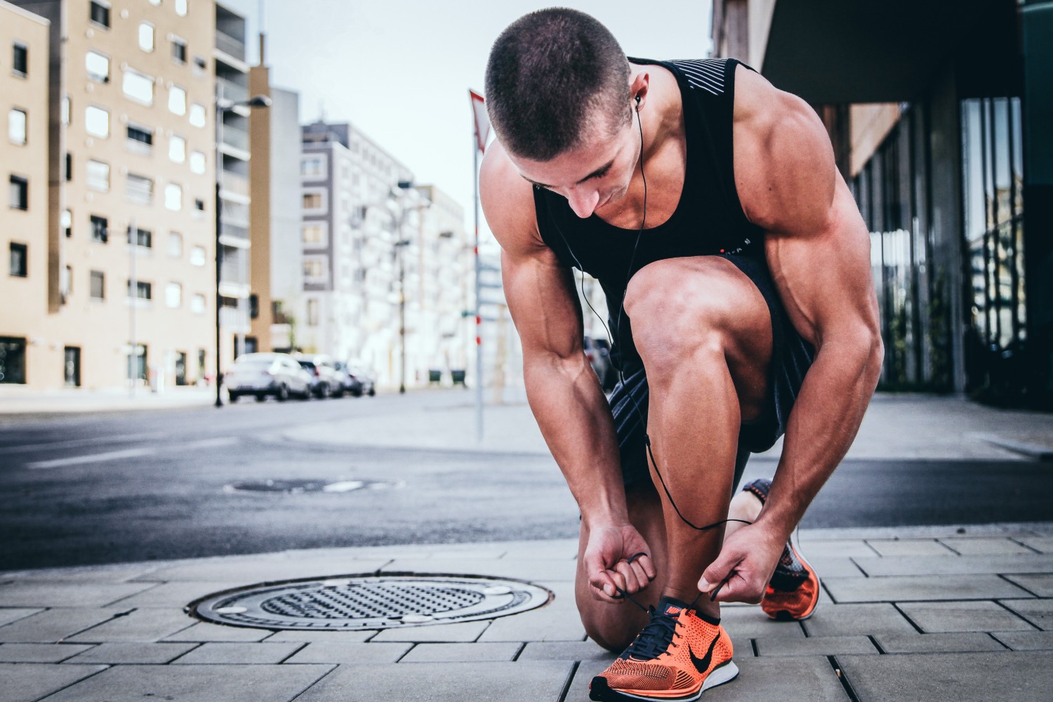 Man tying Nike shoes
