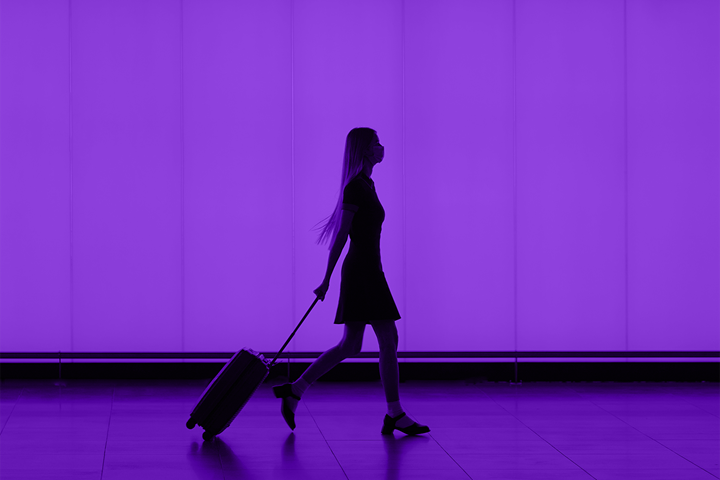 person in front of purple screen