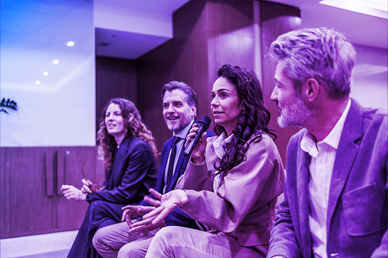 Image of 4 people during a meeting
