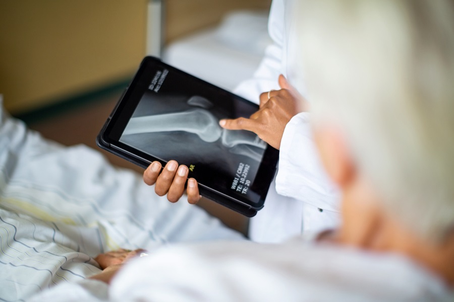 Doctor showing result of radiography to patient
