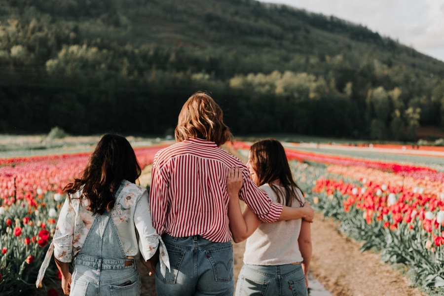 Girls walking through field