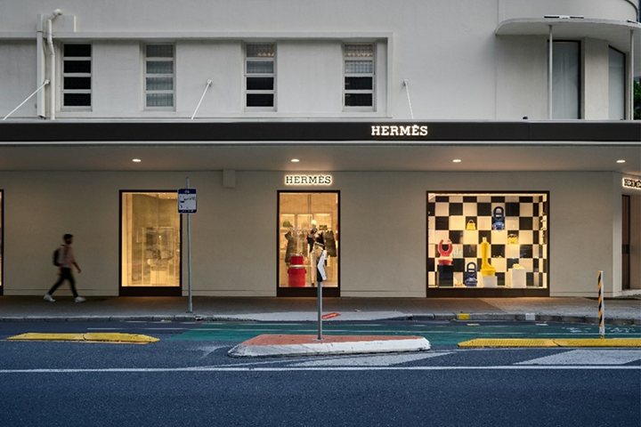 Street view of the Hermes store at dusk