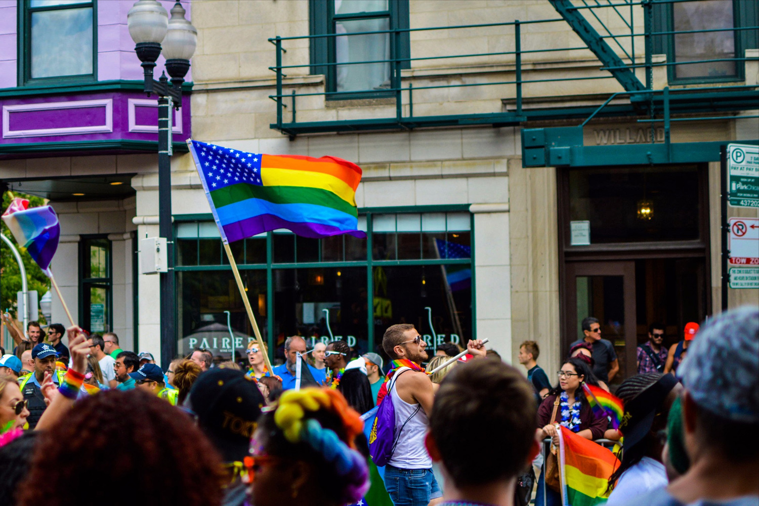 A photo of a busy parade on a street.