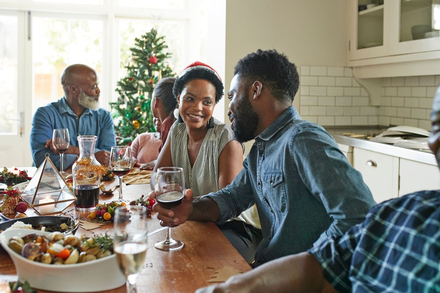 Family laughing at dinner table