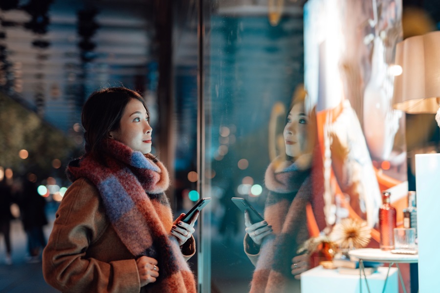 Young woman in shopping, looking for goods